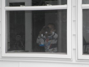 washing windows boy with windex and rags