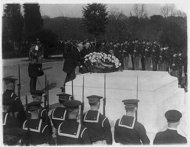 Laying a wreath at the Tomb of the Unknowns on Armistice Day, 1923. November 11 was renamed Veterans Day in 1954.