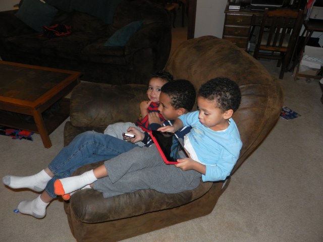 The raucous mob does settle down from time to time, but always in Daddy's chair.